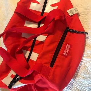 PINK duffel bag. Orange/red